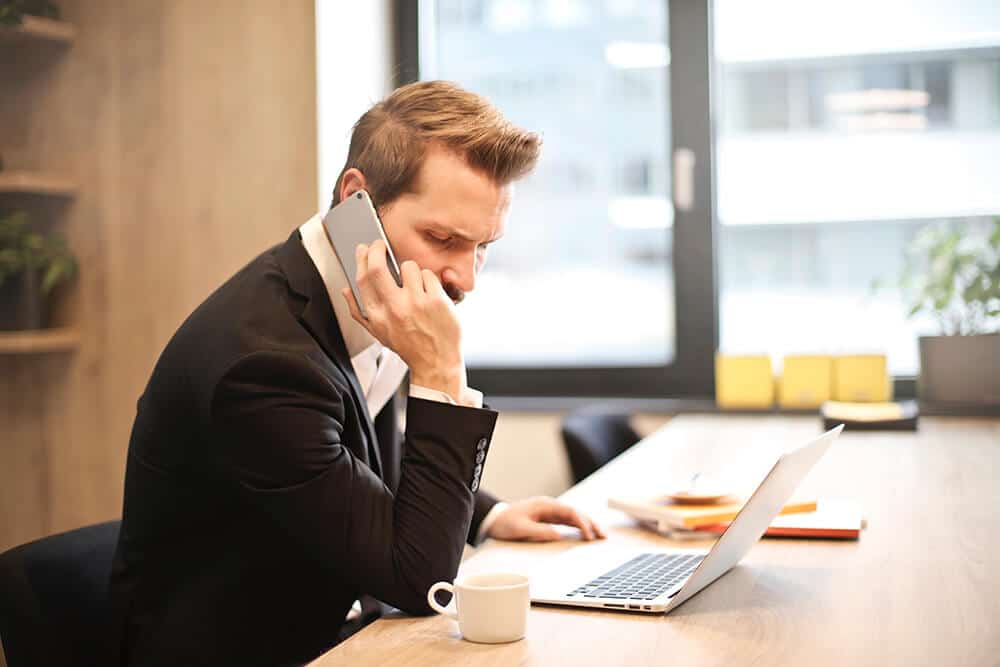 Man talking on phone in office