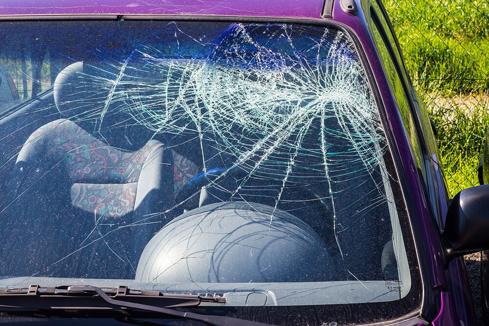 Smashed windshield of car
